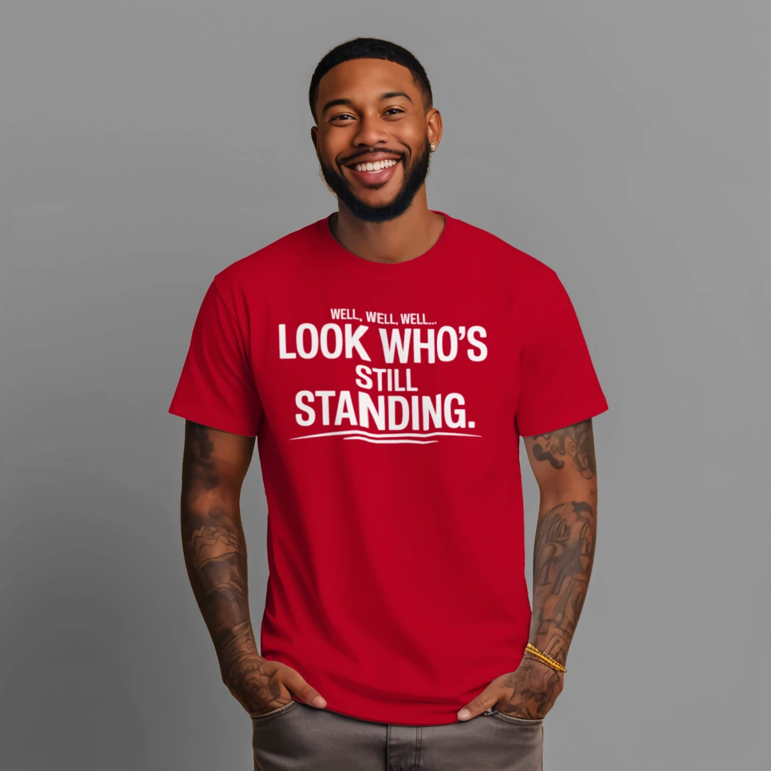 LOOK WHO'S STILL STANDING. | Faith & Resilience T-Shirt